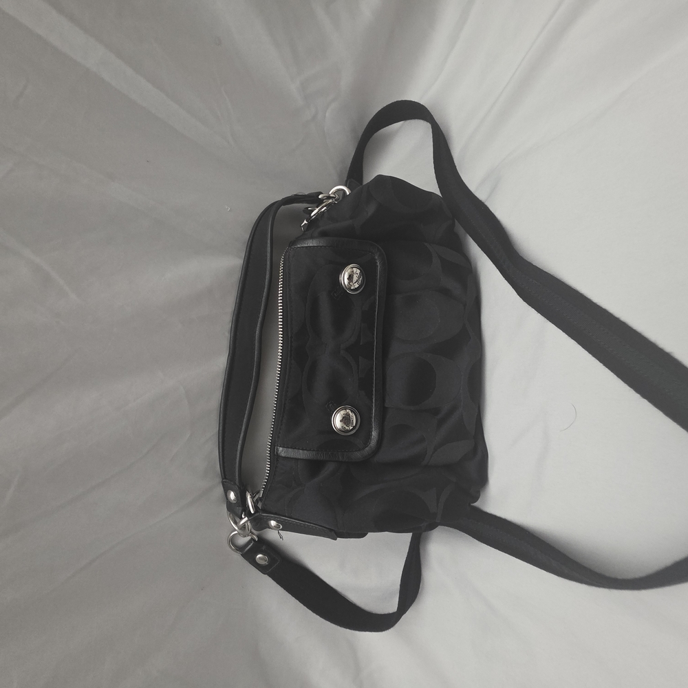 Coach Black Crossbody Bag with Adjustable Strap and Metallic Accents
